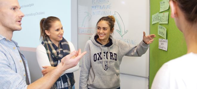 People in front of a pinboard